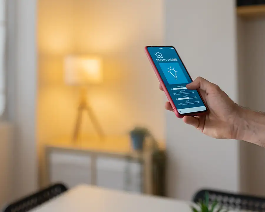 Homeowner using a smart home app to control lighting — JSE Service and Electric LLC smart home electrical installations in O'Fallon, IL and St. Louis, MO