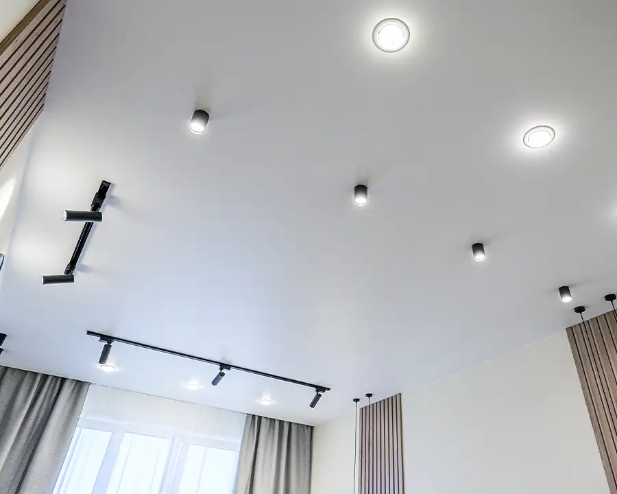 Modern interior ceiling with recessed LED downlights and adjustable track lighting — JSE Service and Electric LLC recessed and track lighting installation in O'Fallon, IL and St. Louis, MO